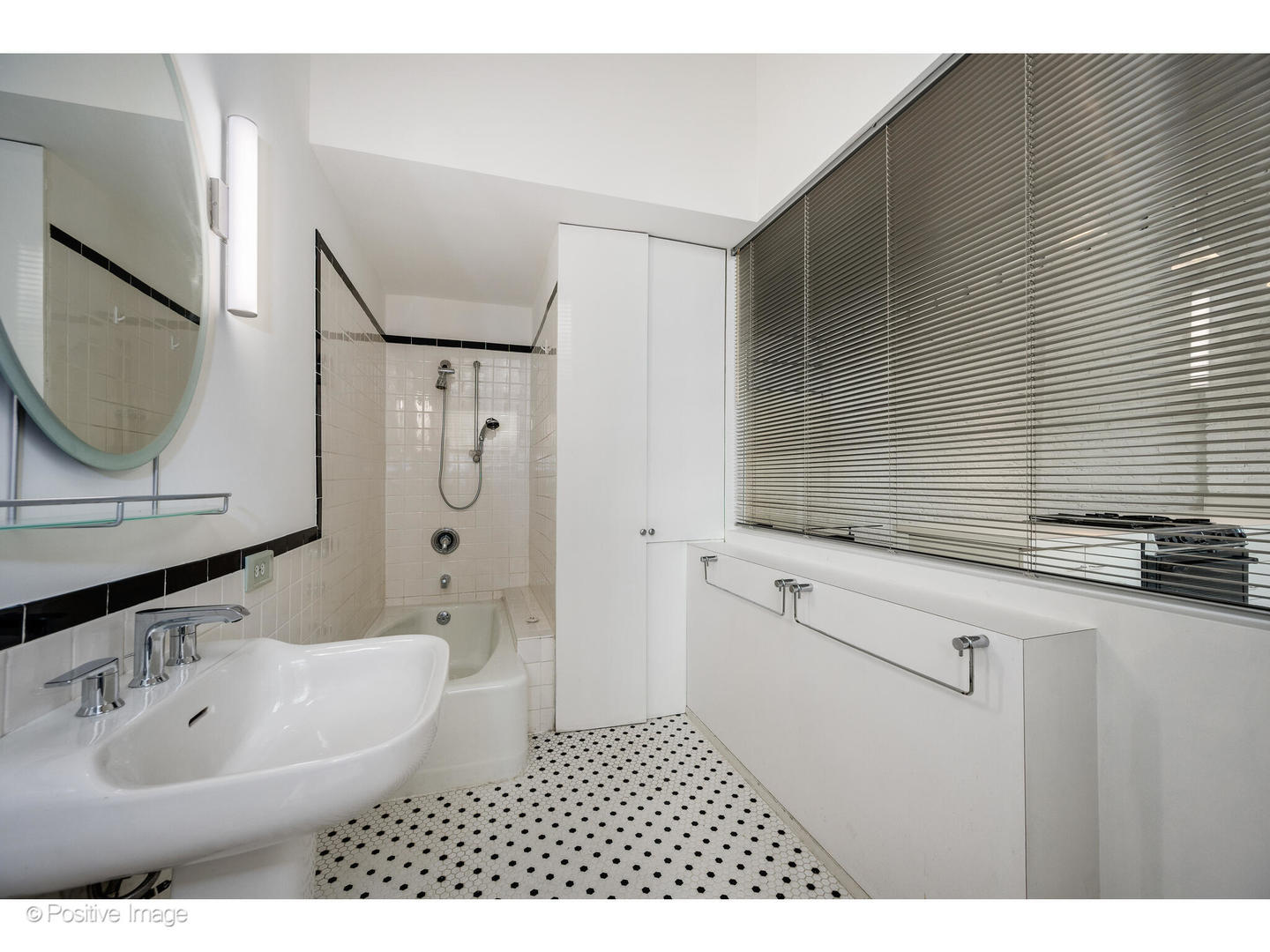 740 North Wells Street Chicago, IL 60654 - Photo 38 of 47 a bathroom with a sink a toilet and shower