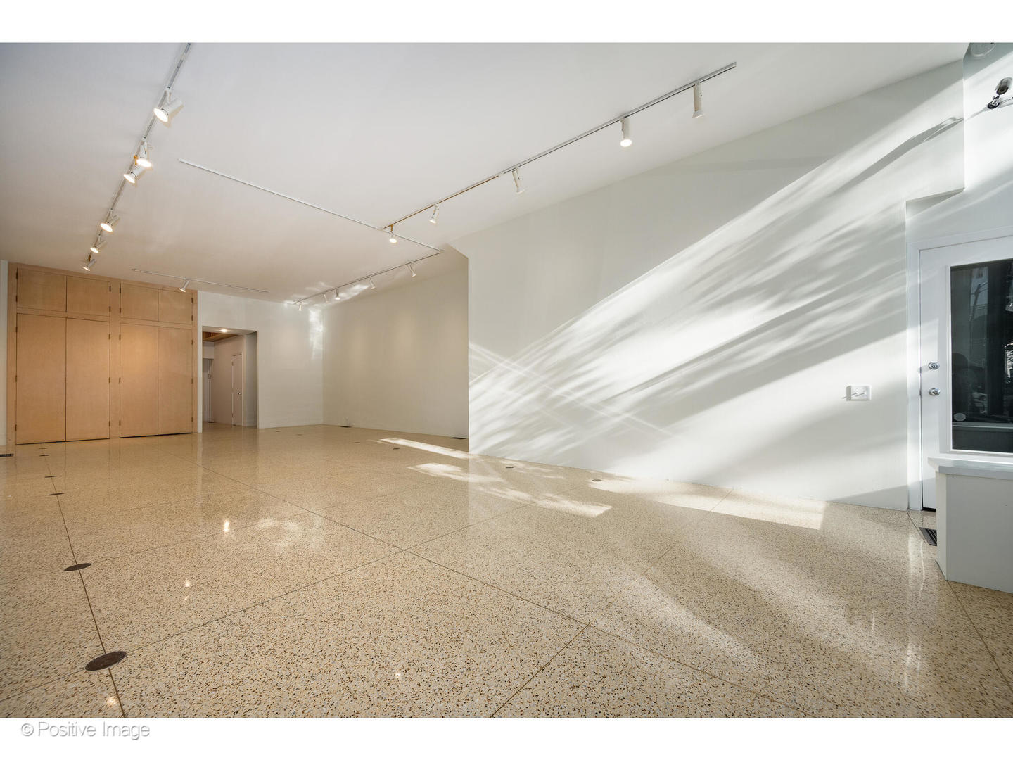 740 North Wells Street Chicago, IL 60654 - Photo 7 of 47 a view of a hallway with wooden floor