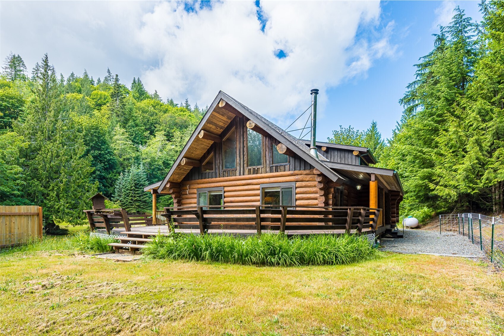 1422 Grauel-Ramapo Road Port Angeles, WA 98363 - Photo 26 of 40 a front view of a house with a garden
