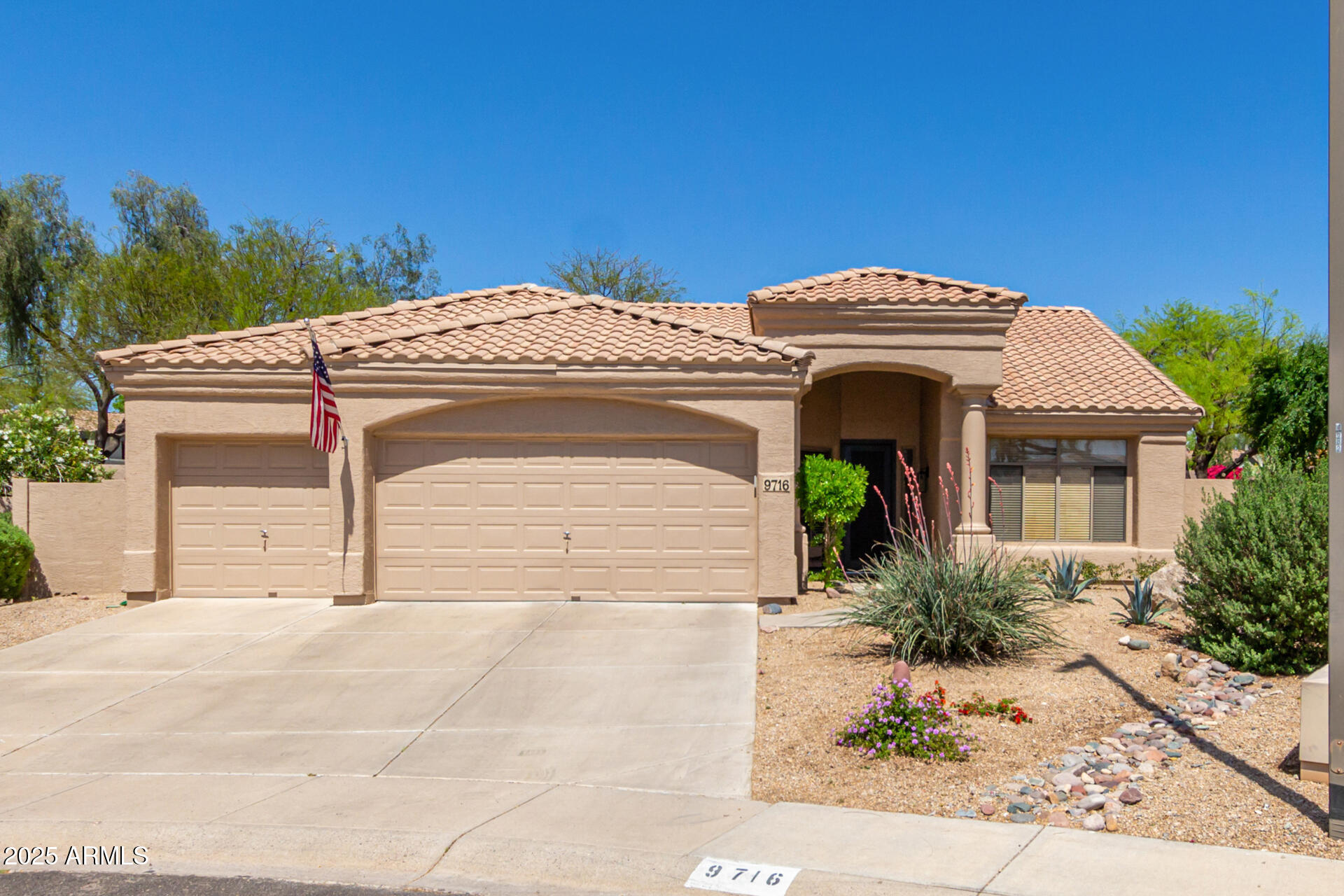 a front view of a house with a garage