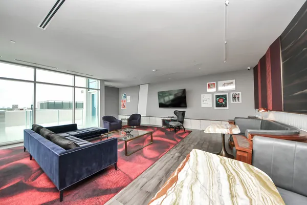 a view of a swimming pool and lounge chairs