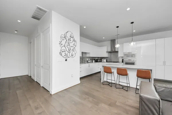 a kitchen with a refrigerator and a sink