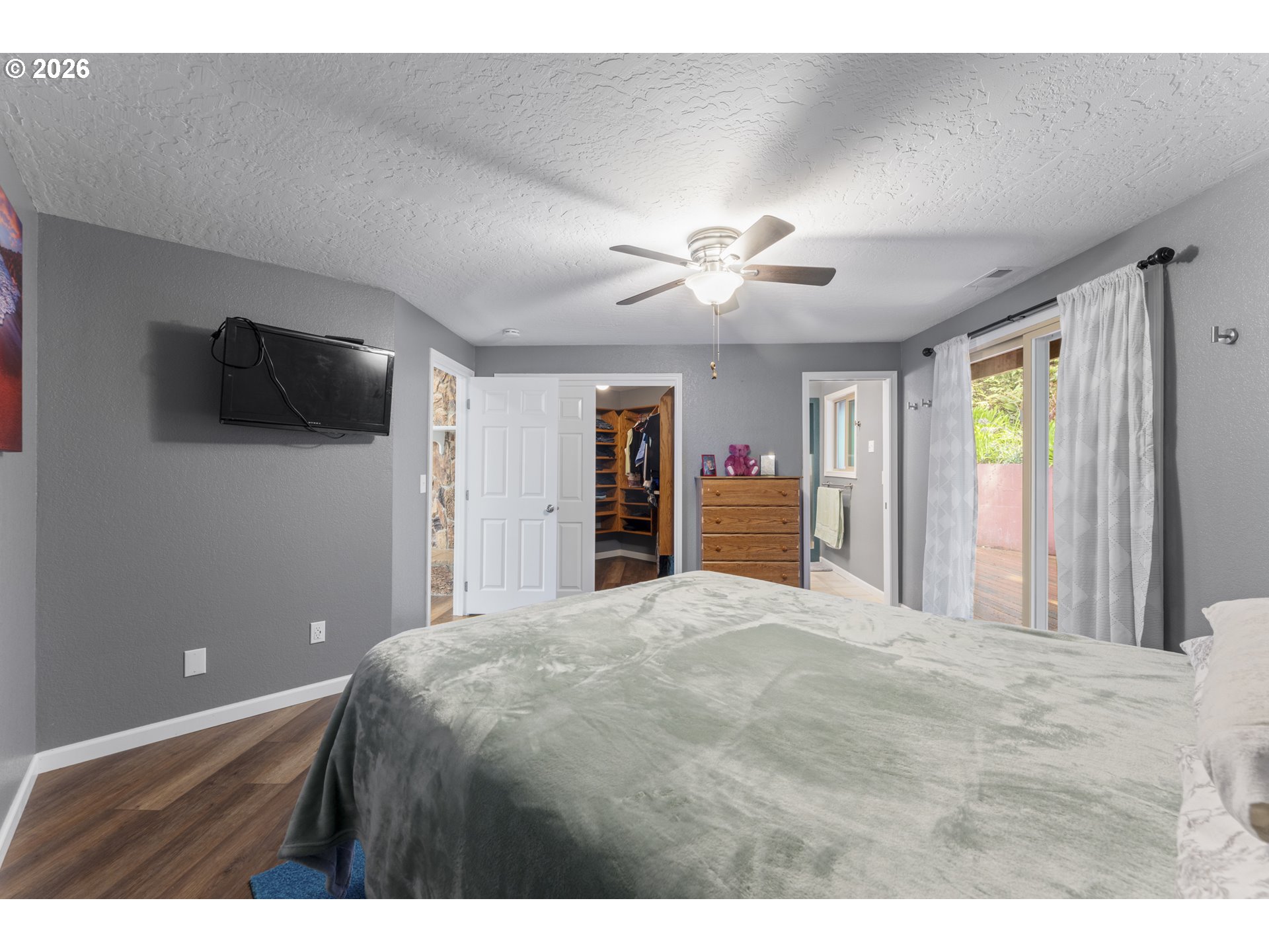 2453 Stephanie Lane North Bend, OR 97459 - Photo 16 of 48 a bedroom with a bed and a flat screen tv