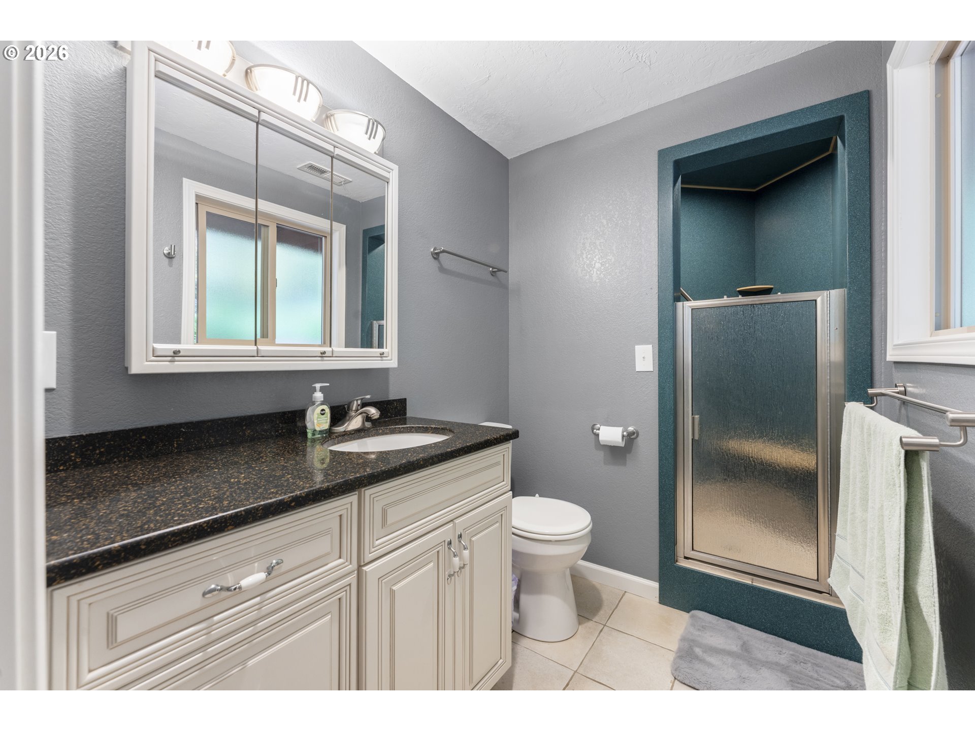 2453 Stephanie Lane North Bend, OR 97459 - Photo 18 of 48 a bathroom with a granite countertop sink toilet and mirror