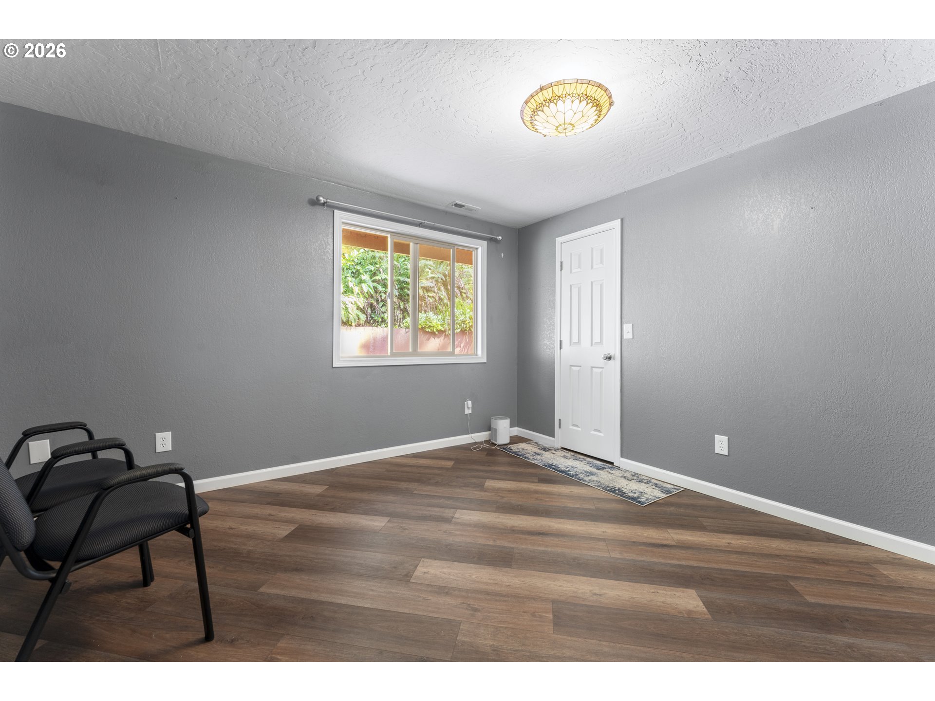 2453 Stephanie Lane North Bend, OR 97459 - Photo 22 of 48 a view of an empty room with a window