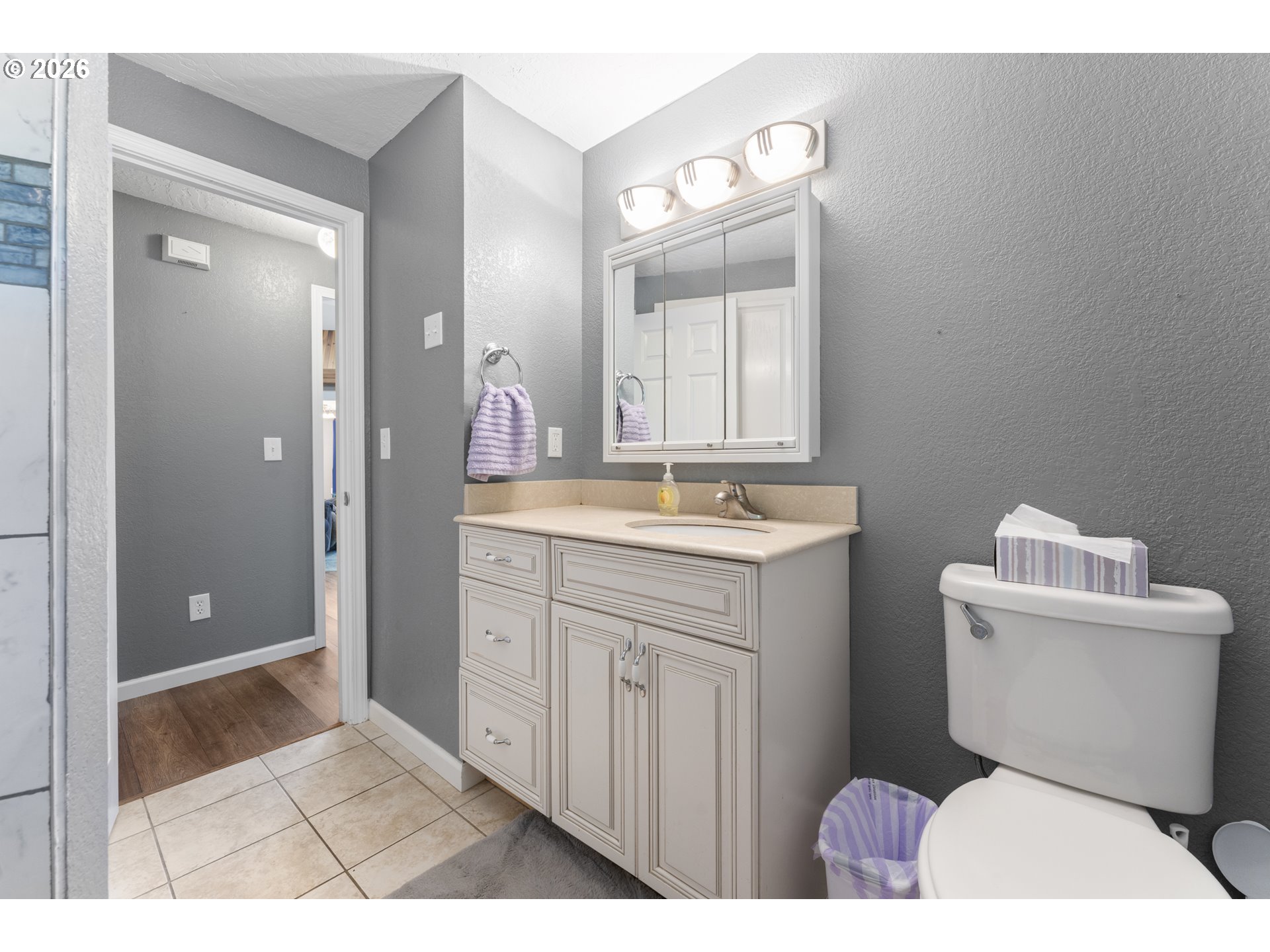 2453 Stephanie Lane North Bend, OR 97459 - Photo 25 of 48 a bathroom with a sink a toilet and mirror