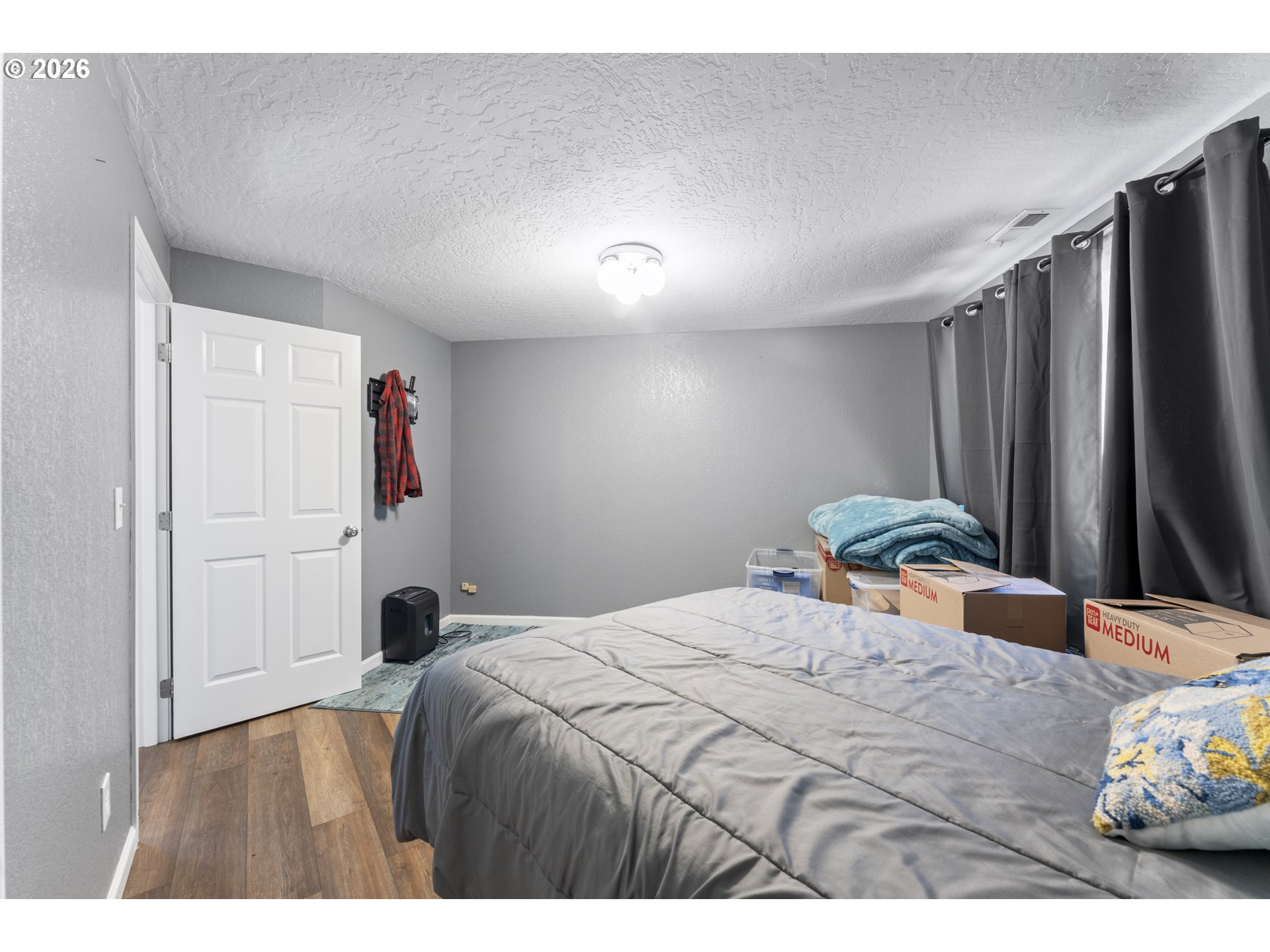 2453 Stephanie Lane North Bend, OR 97459 - Photo 27 of 48 a bedroom with a bed and a dresser
