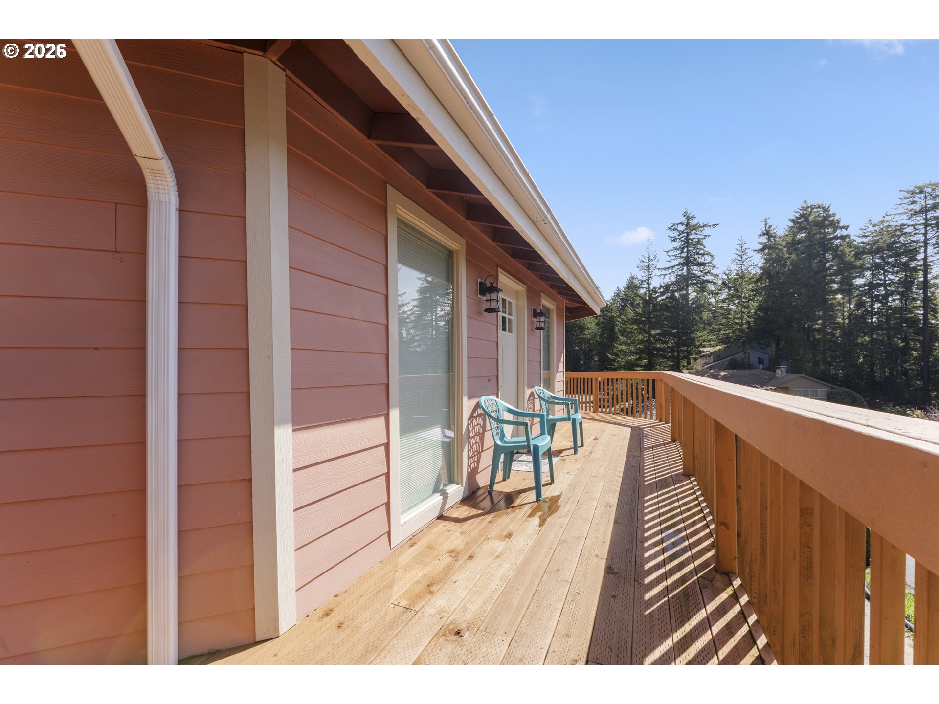 2453 Stephanie Lane North Bend, OR 97459 - Photo 40 of 48 a balcony with chairs and wooden fence