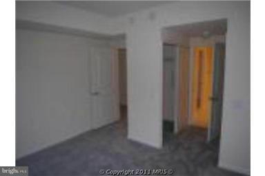 930 Wayne Avenue, Unit 207 Silver Spring, MD 20910 - Photo 8 of 9 a view of a hallway with a door