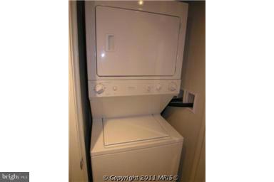 930 Wayne Avenue, Unit 207 Silver Spring, MD 20910 - Photo 9 of 9 a utility room with dryer and washer