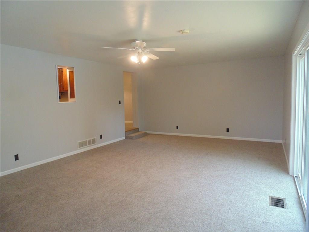Enter into the 23x15 Family Room.  The 1st floor laundry is located to the left, and supply lines have been run for a full bath in that area.  
