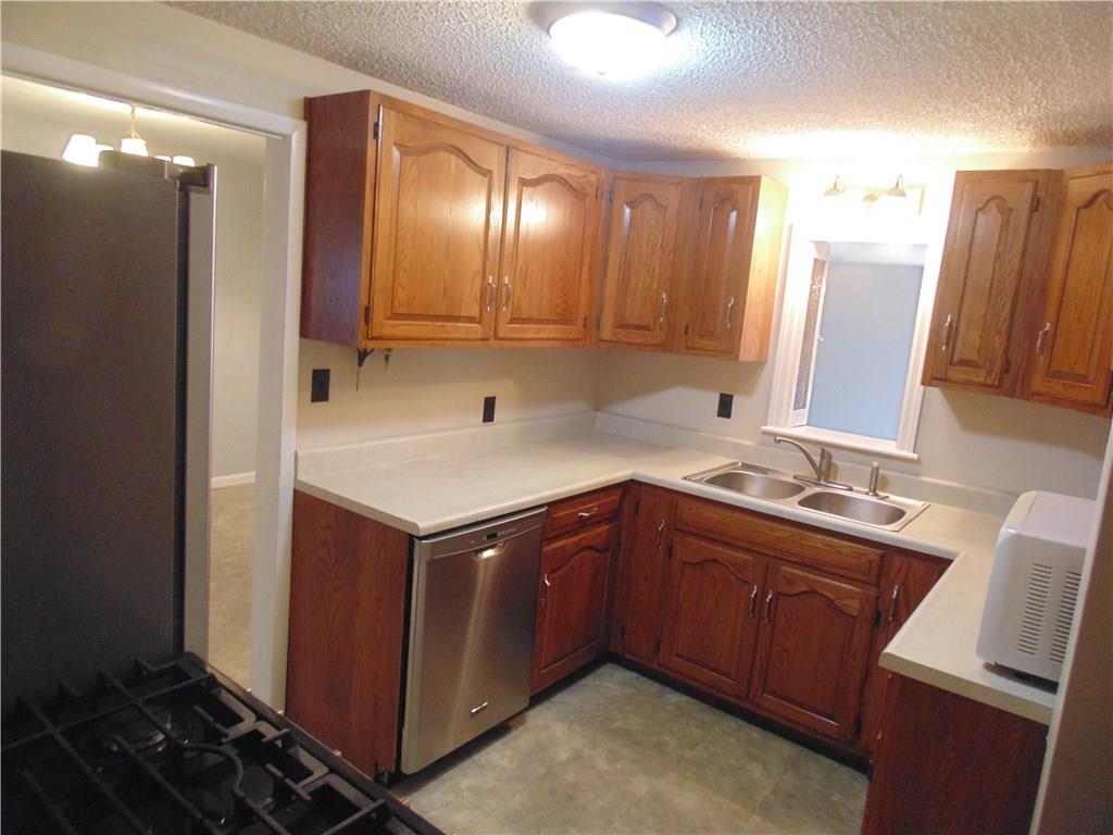 The efficient kitchen sits literally in the heart of the home, and is updated.  A pass through to the family room offers the chef an opportunity to join in on entertaining while cooking.