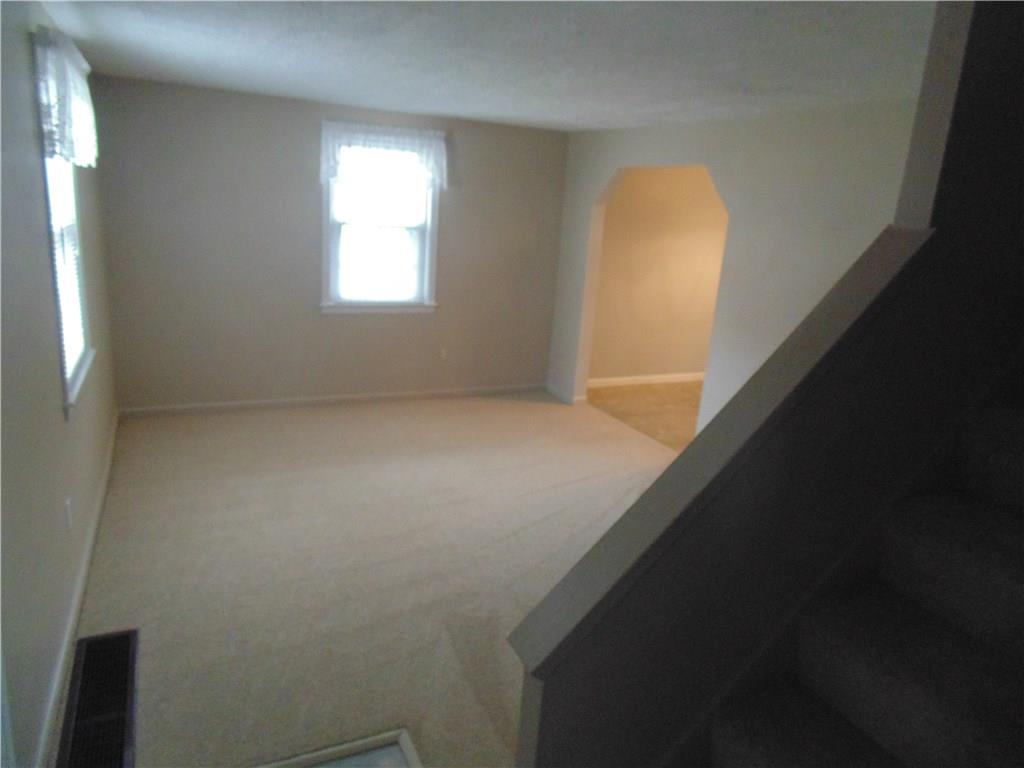 139 South Duffy Road Butler, PA 16001 - Photo 9 of 20 The formal living room leads into the dining area.