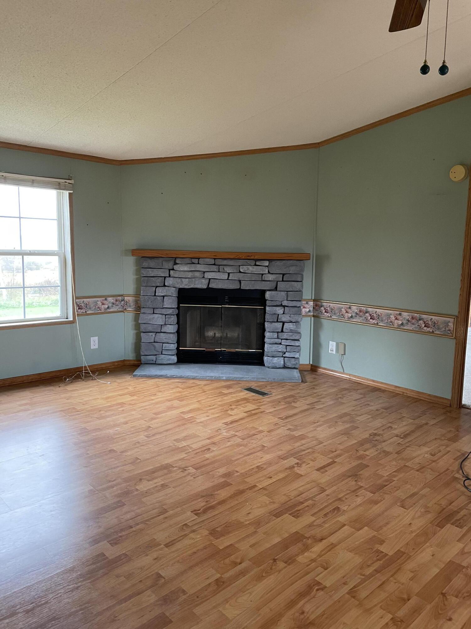 339 Grand Falls Road Limestone, ME 04750 - Photo 10 of 22 Gas fireplace in Lining roon