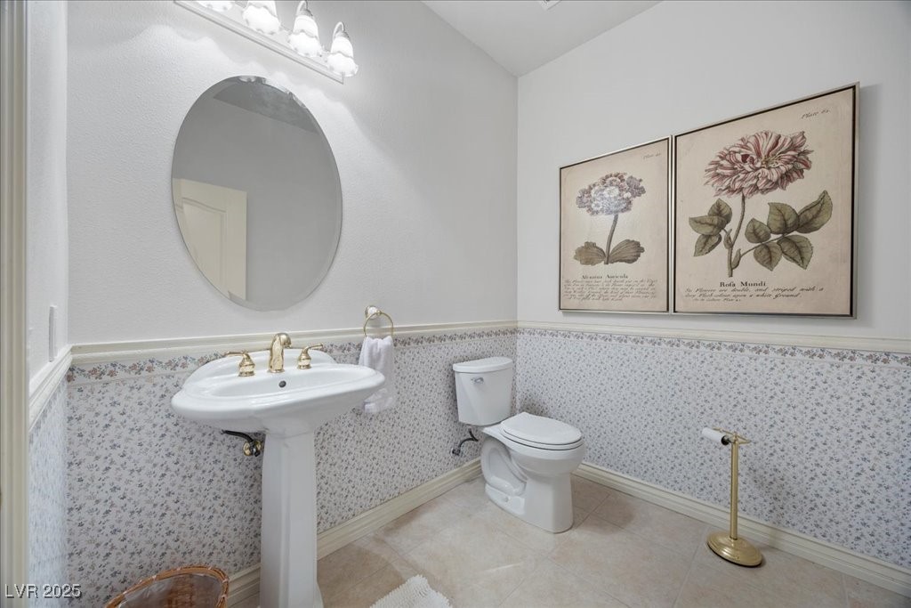 640 Quail Covey Road Henderson, NV 89002 - Photo 26 of 75 Guest Half bathroom with tile patterned floors