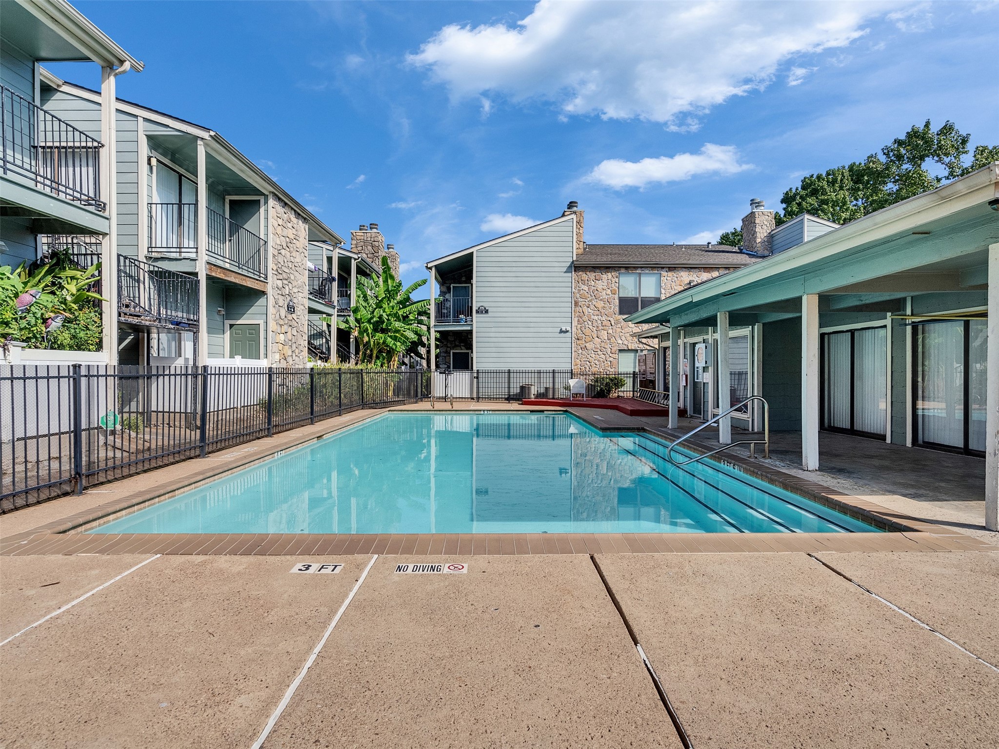 3764 Tanglewilde Street, Unit H8 Houston, TX 77063 - Photo 11 of 22 a view of a house with a swimming pool and a yard