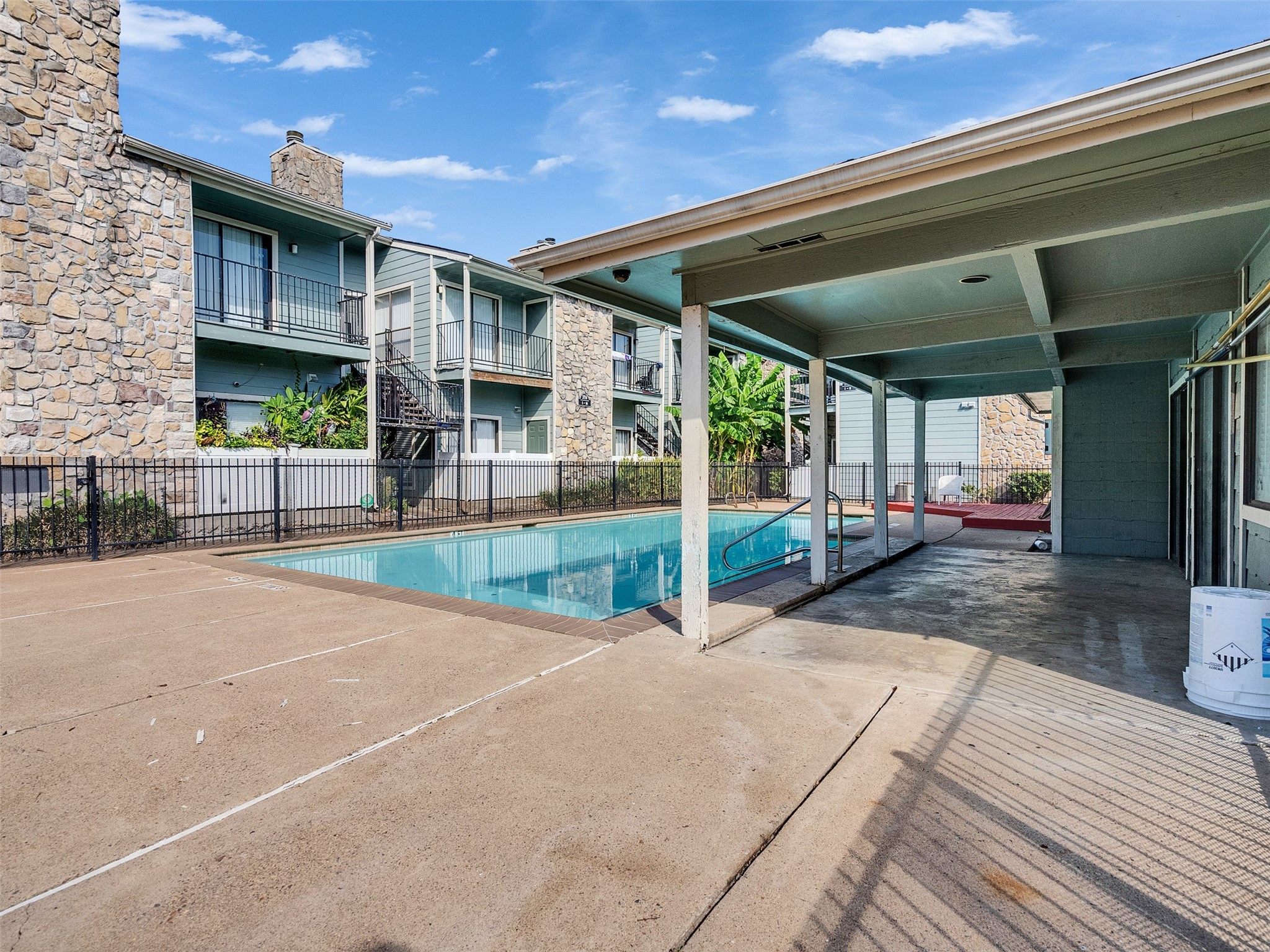 3764 Tanglewilde Street, Unit H8 Houston, TX 77063 - Photo 12 of 22 a view of a house with a patio