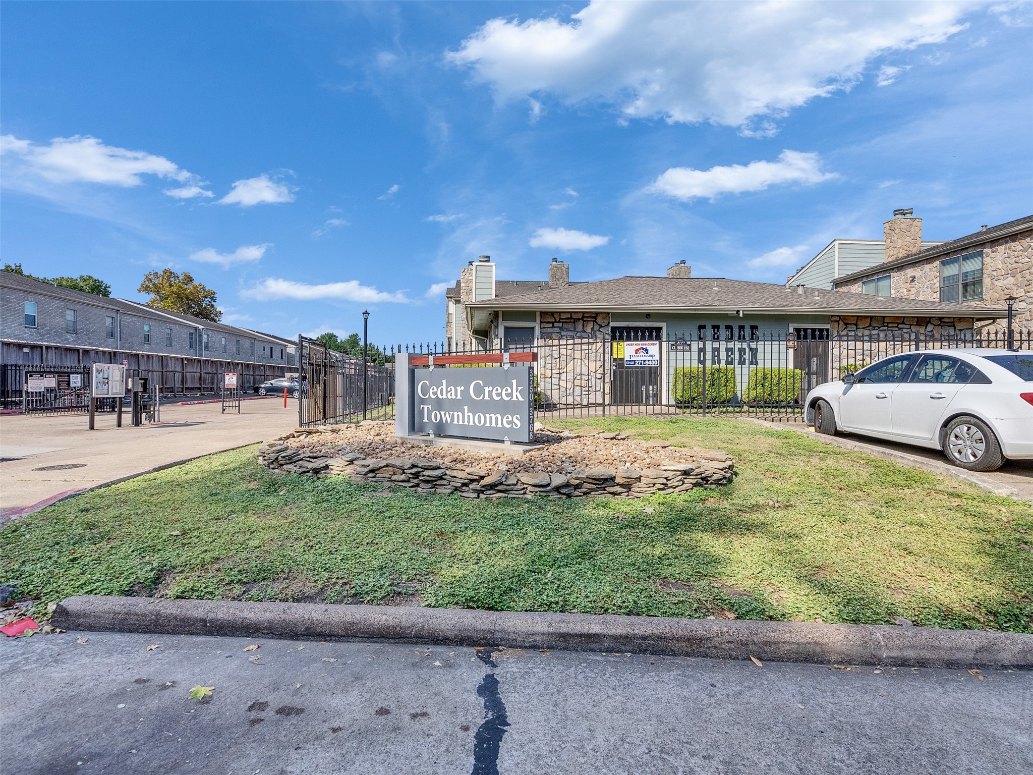 3764 Tanglewilde Street, Unit H8 Houston, TX 77063 - Photo 16 of 22 a front view of a house with a yard