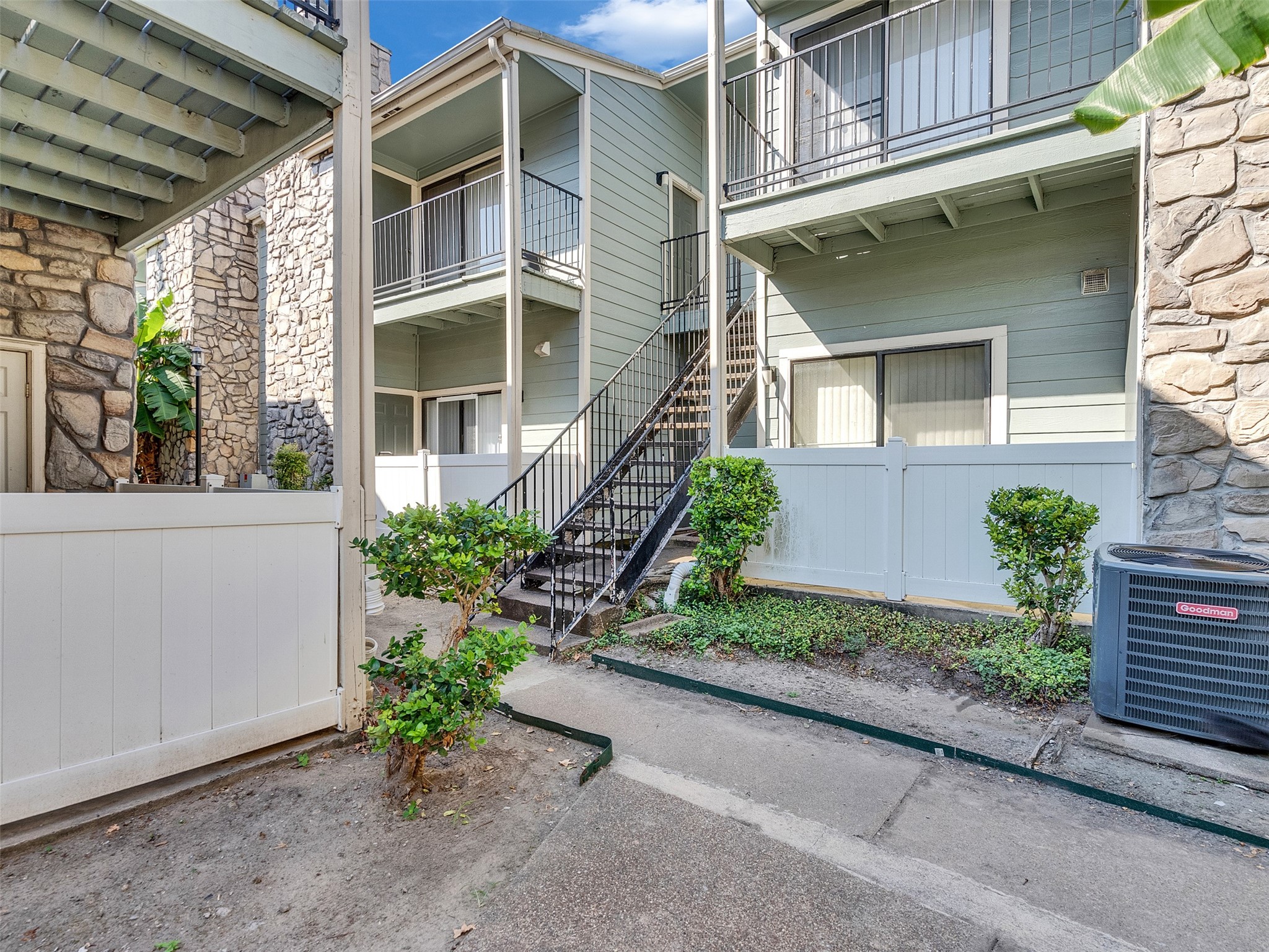 3764 Tanglewilde Street, Unit H8 Houston, TX 77063 - Photo 18 of 22 a front view of a house with a yard
