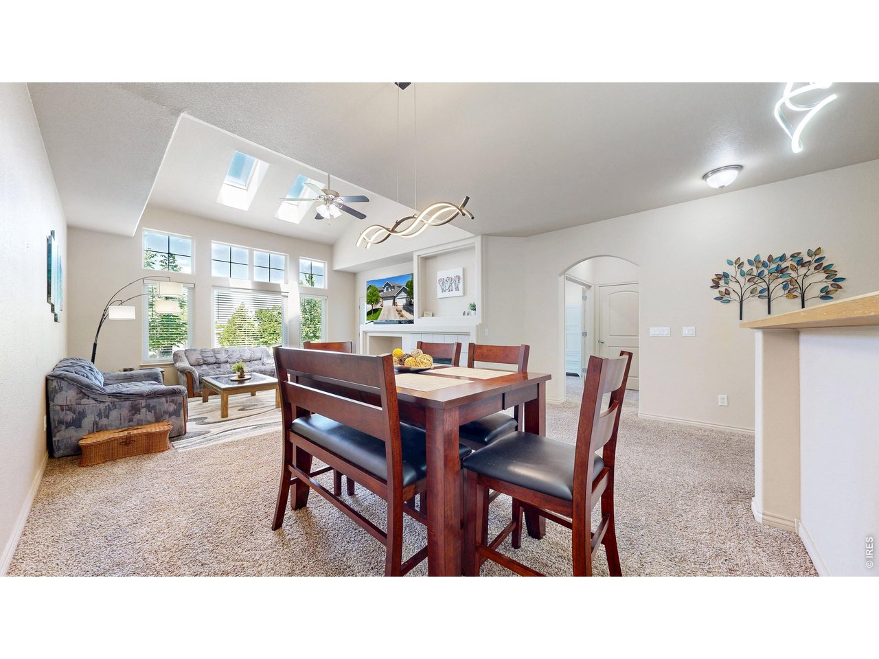 4672 West 20th Road, Unit 413 Greeley, CO 80634 - Photo 14 of 37 a living room with furniture and a table