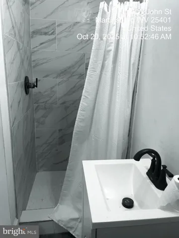 a kitchen with a refrigerator sink and microwave