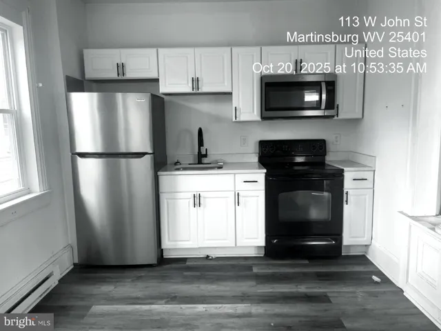 a view of staircase with white walls