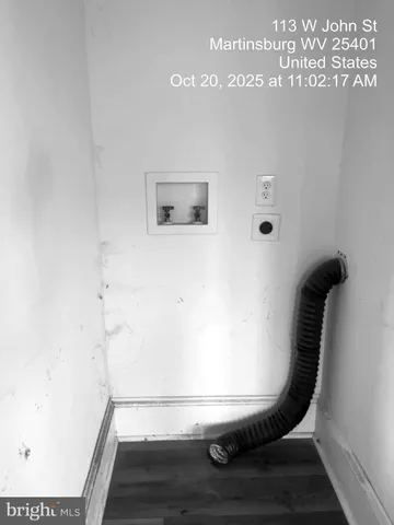 a view of staircase with wooden floor and windows