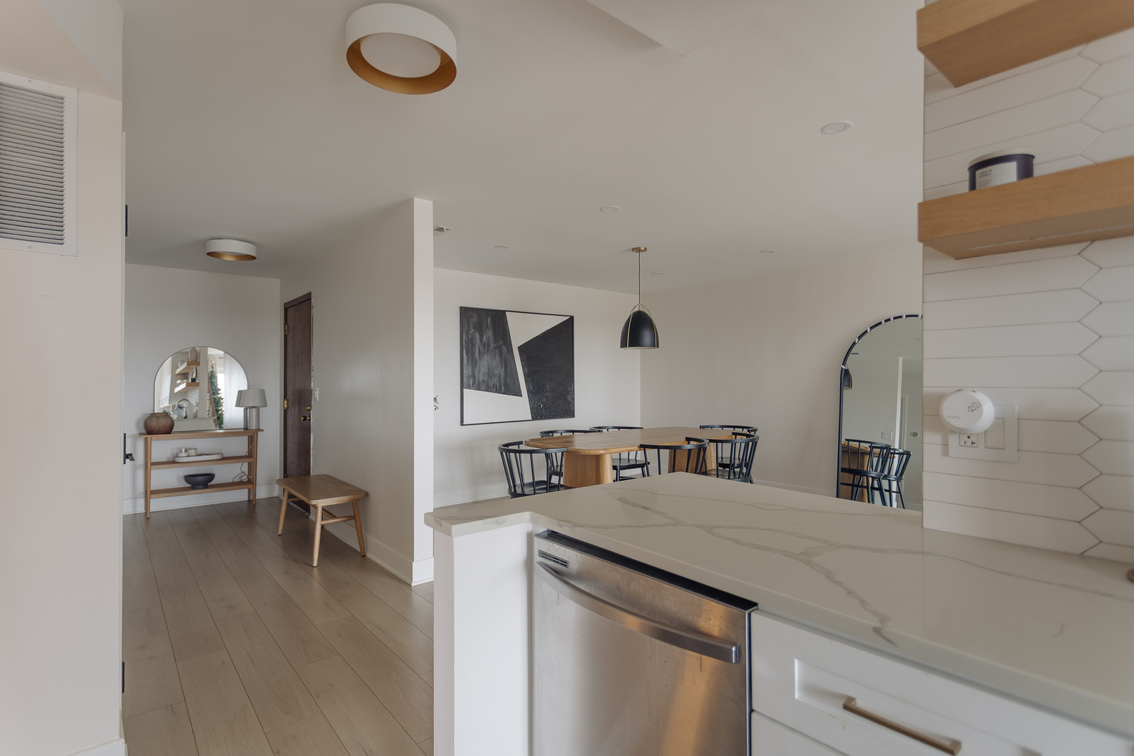 8100 West Foster Lane, Unit 508 Niles, IL 60714 - Photo 11 of 42 a kitchen with a sink cabinets and wooden floor