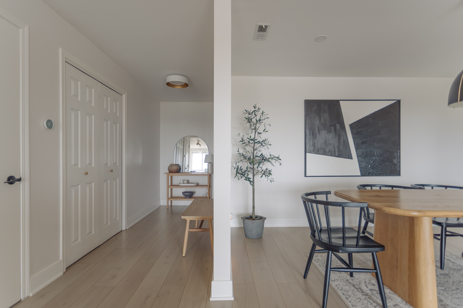 8100 West Foster Lane, Unit 508 Niles, IL 60714 - Photo 12 of 42 a view of a dining room with furniture and wooden floor