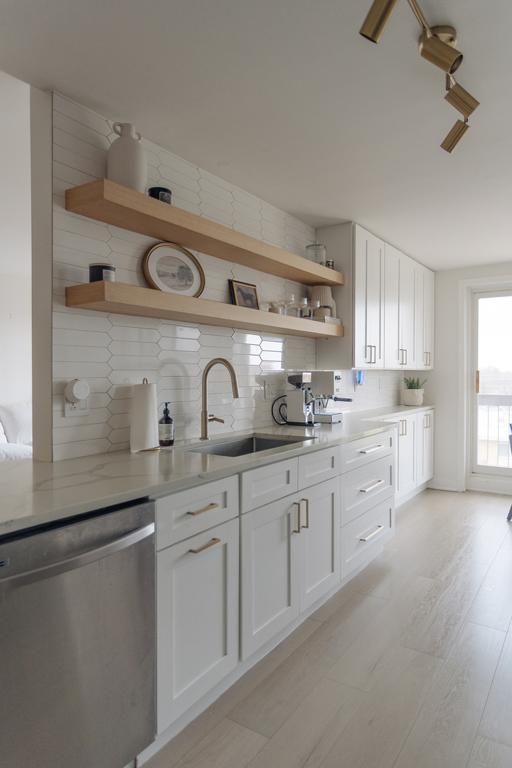8100 West Foster Lane, Unit 508 Niles, IL 60714 - Photo 13 of 42 a kitchen with white cabinets and sink
