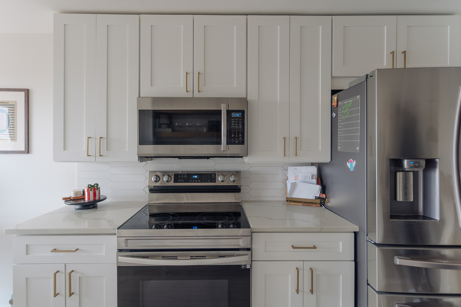 8100 West Foster Lane, Unit 508 Niles, IL 60714 - Photo 17 of 42 a kitchen with stainless steel appliances granite countertop a refrigerator stove and white cabinets