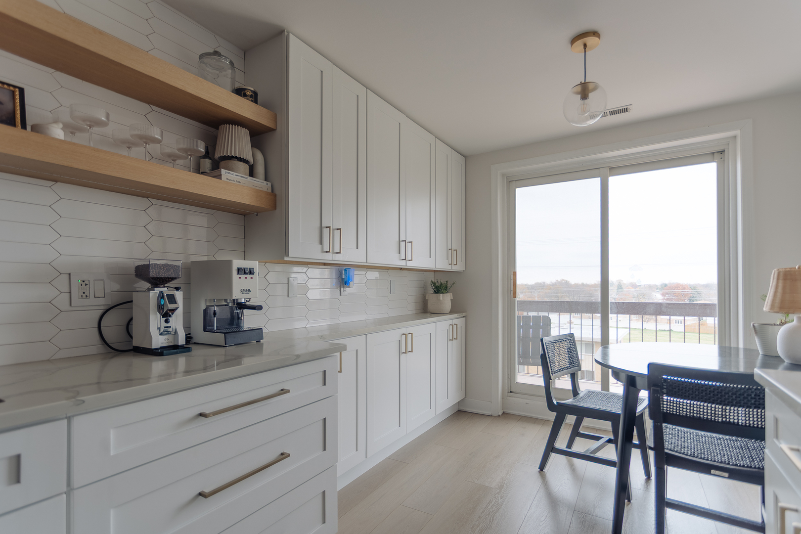 8100 West Foster Lane, Unit 508 Niles, IL 60714 - Photo 18 of 42 a kitchen with stainless steel appliances granite countertop white cabinets and a window