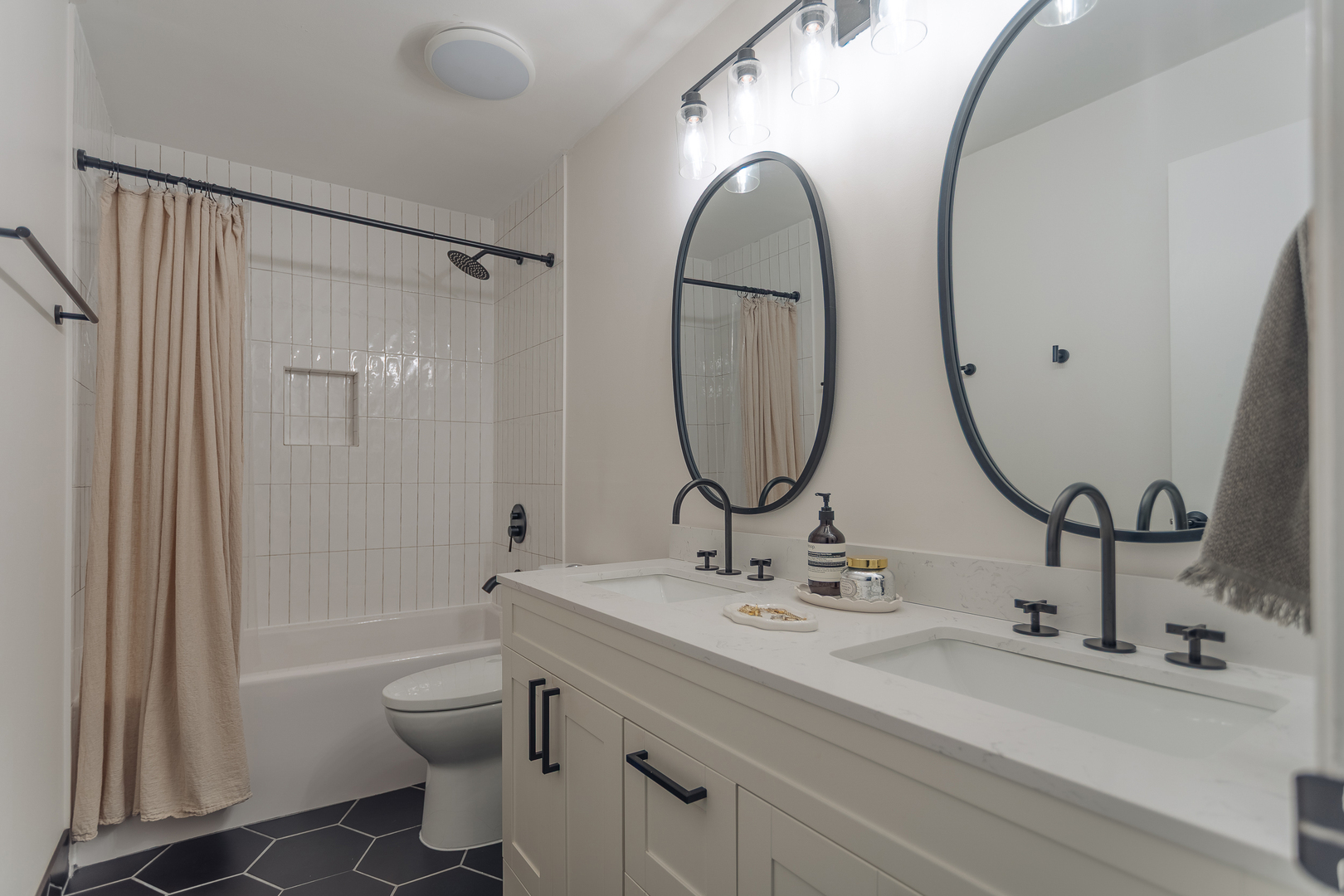 8100 West Foster Lane, Unit 508 Niles, IL 60714 - Photo 23 of 42 a bathroom with a sink mirror toilet and shower