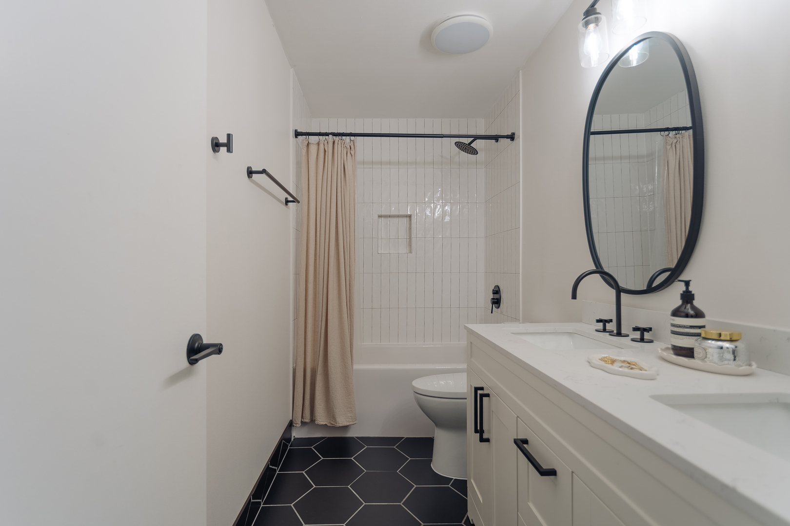 8100 West Foster Lane, Unit 508 Niles, IL 60714 - Photo 24 of 42 a bathroom with a sink a toilet and a mirror