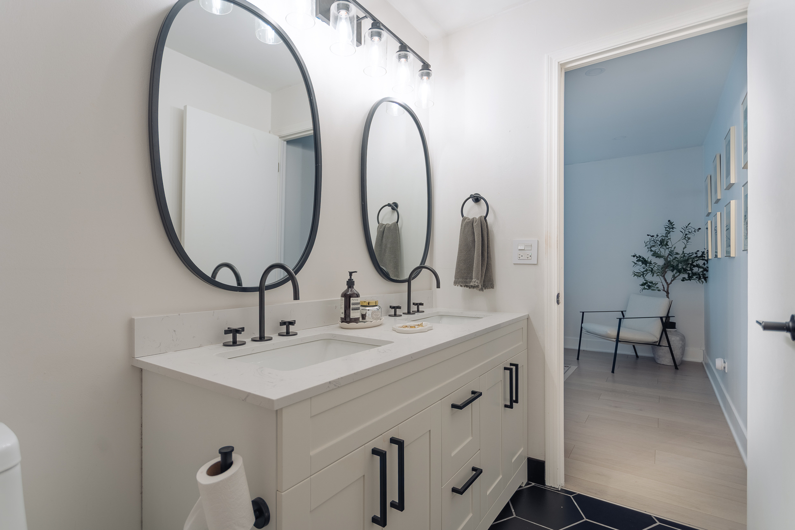 8100 West Foster Lane, Unit 508 Niles, IL 60714 - Photo 26 of 42 a bathroom with a double vanity sink and a mirror