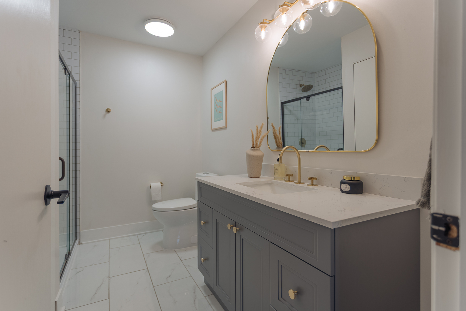 8100 West Foster Lane, Unit 508 Niles, IL 60714 - Photo 27 of 42 a bathroom with a toilet sink and mirror