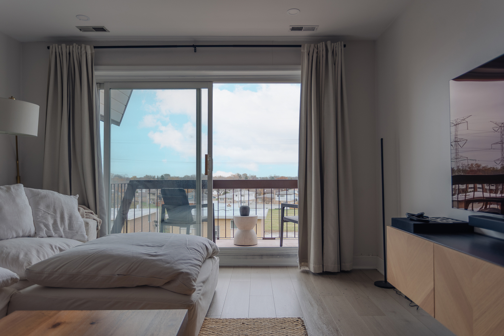 8100 West Foster Lane, Unit 508 Niles, IL 60714 - Photo 34 of 42 a living room with a large window and a balcony