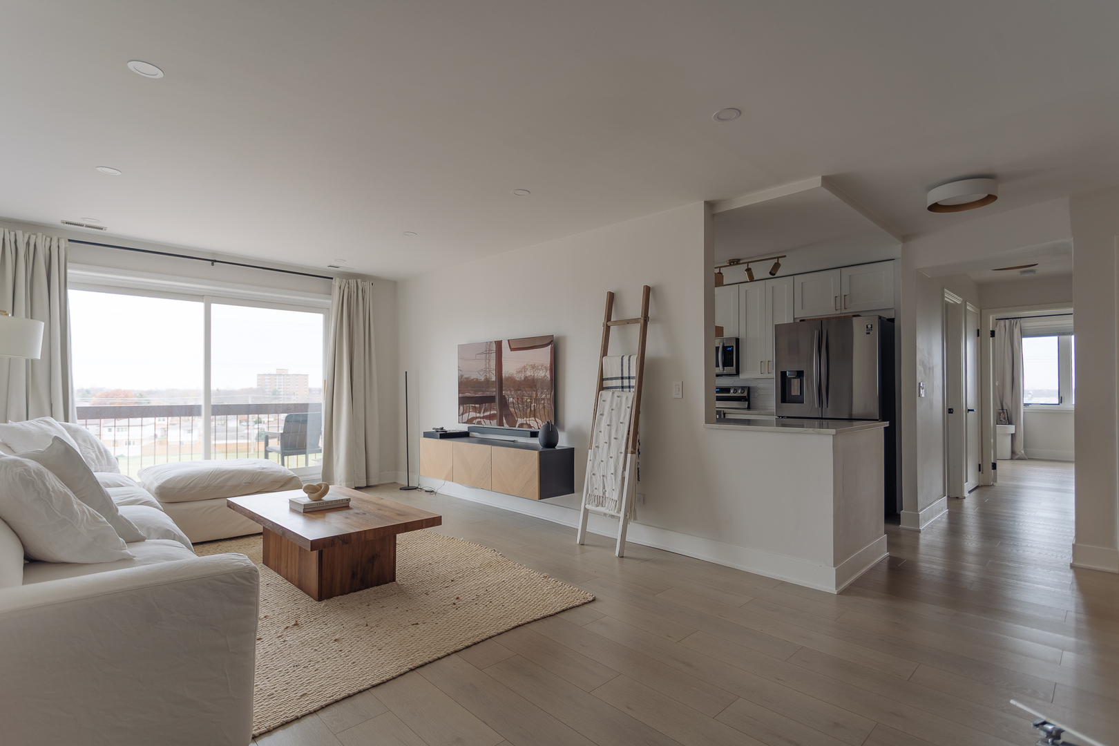 8100 West Foster Lane, Unit 508 Niles, IL 60714 - Photo 5 of 42 a living room with furniture and a large window