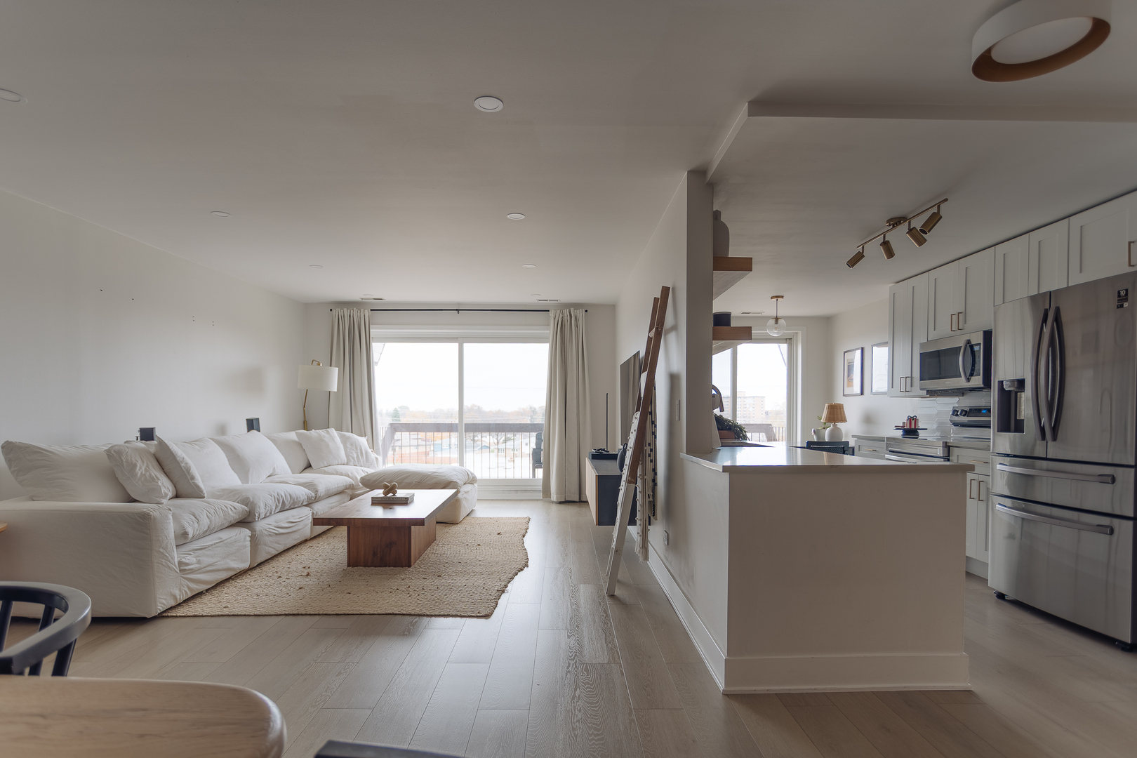 8100 West Foster Lane, Unit 508 Niles, IL 60714 - Photo 6 of 42 a living room with stainless steel appliances furniture and a window