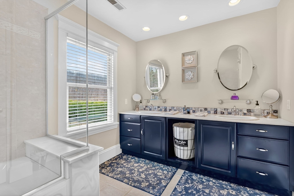 34 Main Street Wilbraham, MA 01095 - Photo 25 of 41 a bathroom with a sink a vanity and a mirror