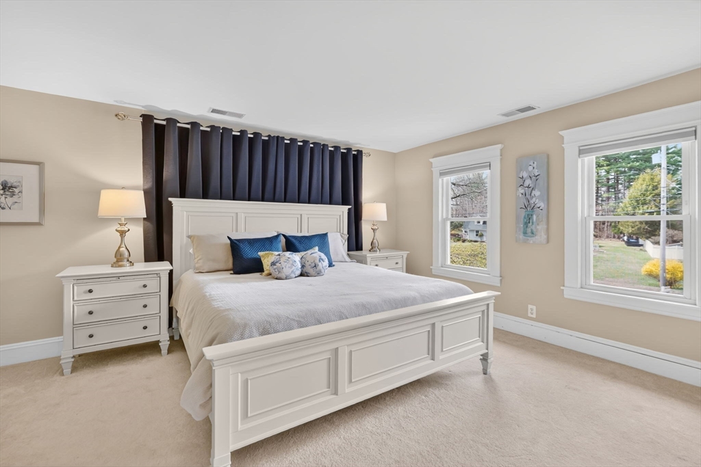 34 Main Street Wilbraham, MA 01095 - Photo 27 of 41 a bed sitting in a bedroom next to a window