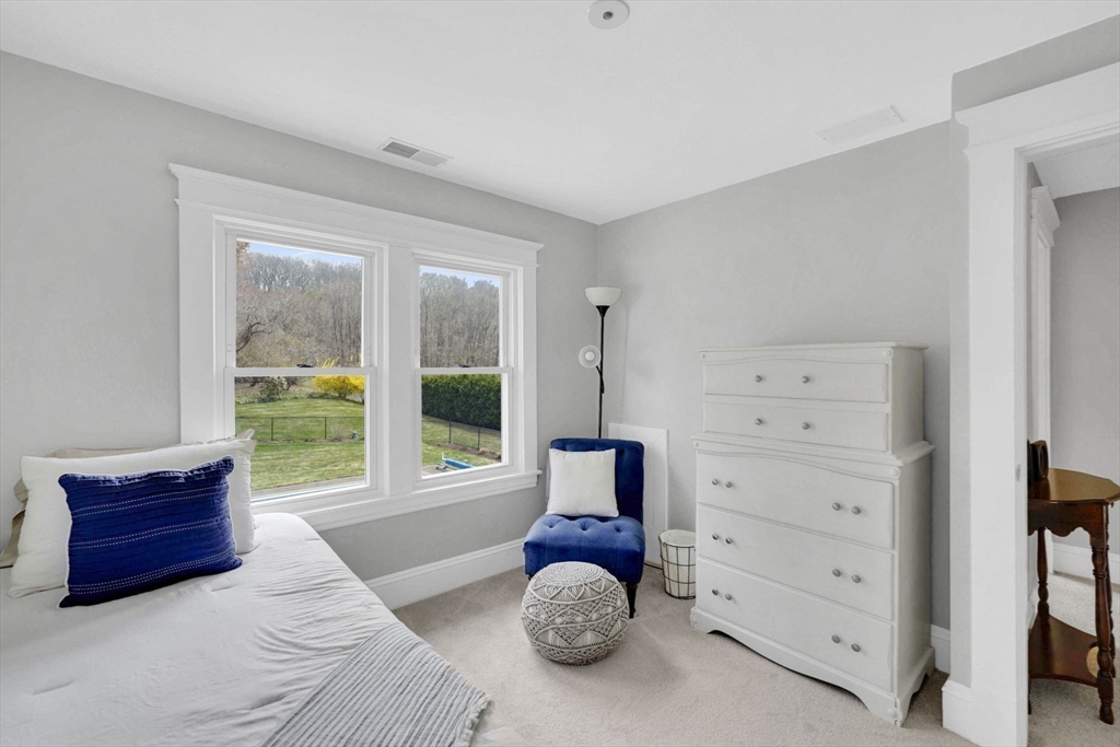 34 Main Street Wilbraham, MA 01095 - Photo 30 of 41 a bedroom with a bed and large windows