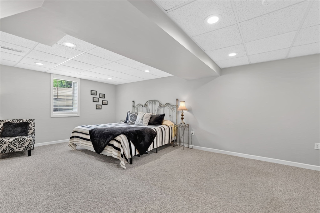 34 Main Street Wilbraham, MA 01095 - Photo 31 of 41 a spacious bedroom with a bed and a window