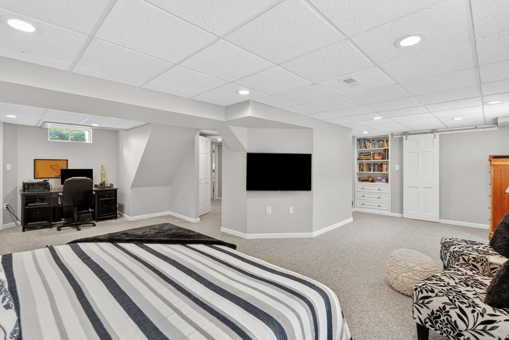 34 Main Street Wilbraham, MA 01095 - Photo 32 of 41 a bedroom with furniture and a flat screen tv