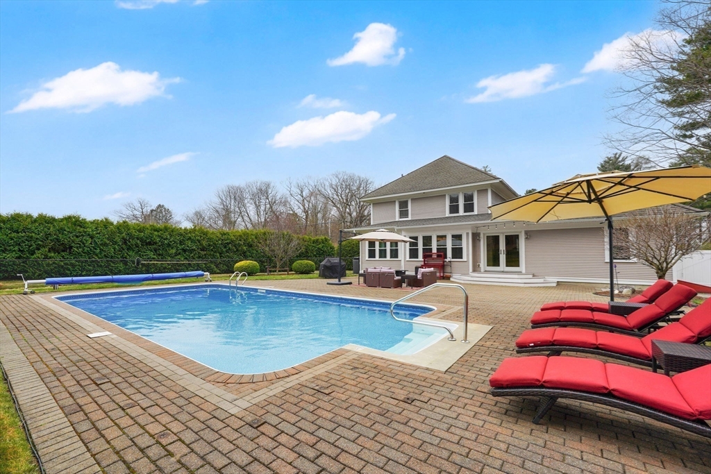 34 Main Street Wilbraham, MA 01095 - Photo 36 of 41 a view of a house with pool lawn chairs and a fire pit