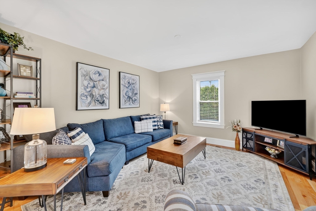 34 Main Street Wilbraham, MA 01095 - Photo 6 of 41 a living room with furniture and a flat screen tv