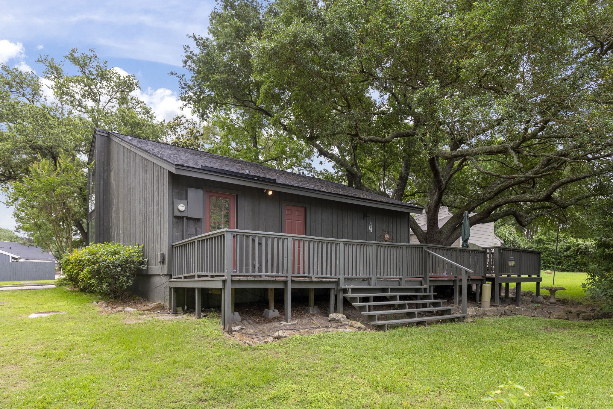49 April Village Conroe, TX 77356 - Photo 30 of 46 a view of a house with a yard and sitting area