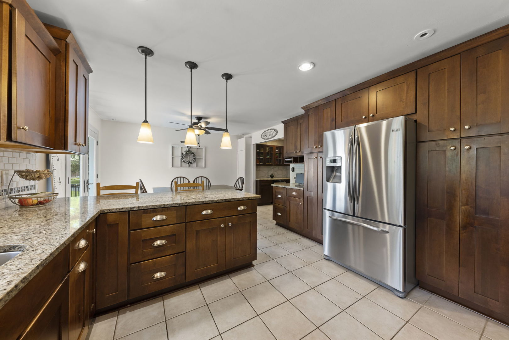 4083 West Sandwich Road Sandwich, IL 60548 - Photo 16 of 74 a kitchen with granite countertop a refrigerator and a sink