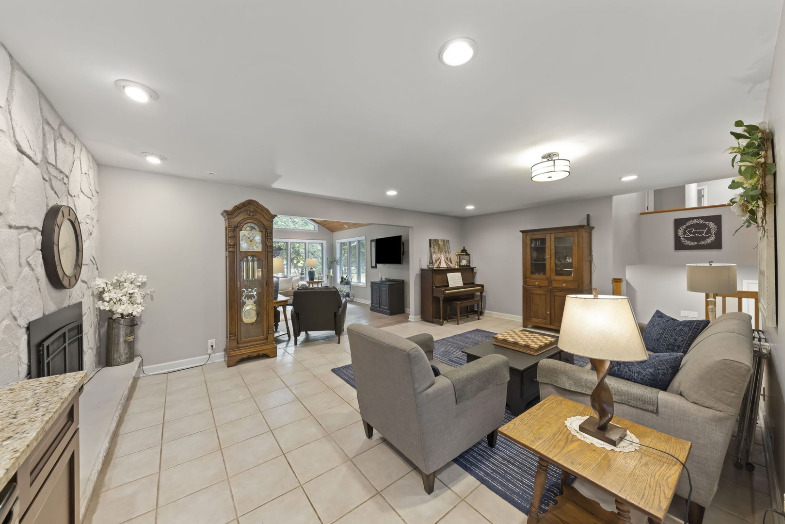 4083 West Sandwich Road Sandwich, IL 60548 - Photo 20 of 74 a living room with furniture and a fireplace