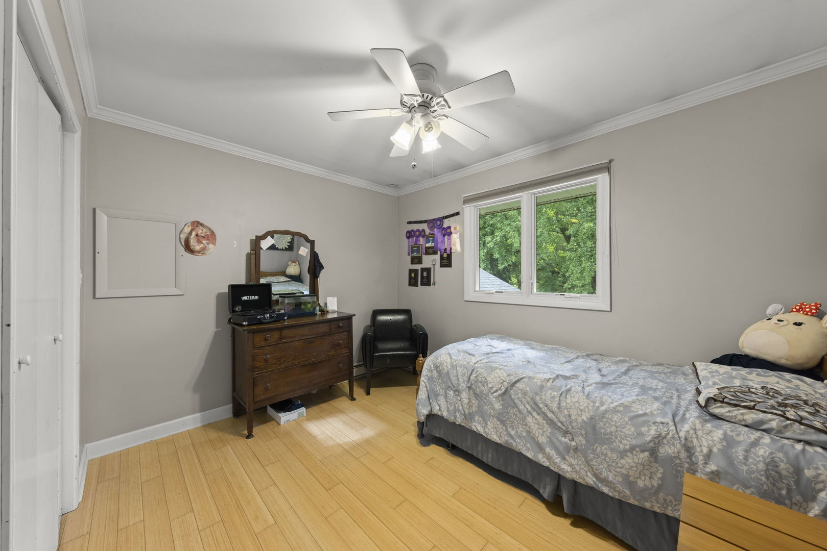 4083 West Sandwich Road Sandwich, IL 60548 - Photo 22 of 74 a bedroom with a bed and a chandelier